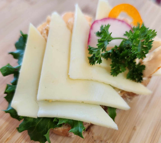 Just cheese: sourdough bread, cream cheese base, mozzarella cheese, vegetable garnish. Sold in quantities of 8 or 20 sandwiches. Mix and match in a box!