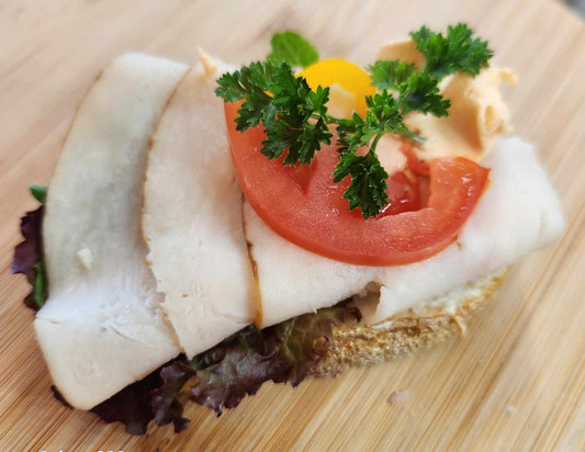 Turkey slice: Sourdough bread, cream cheese base, turkey, vegetable garnish. Sold in quantities of 8 or 20 sandwiches. Mix and match in a box!